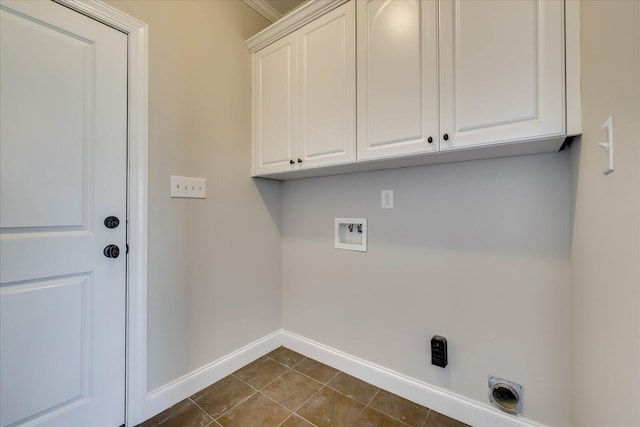 laundry room featuring dark tile patterned floors, electric dryer hookup, baseboards, hookup for a washing machine, and cabinet space
