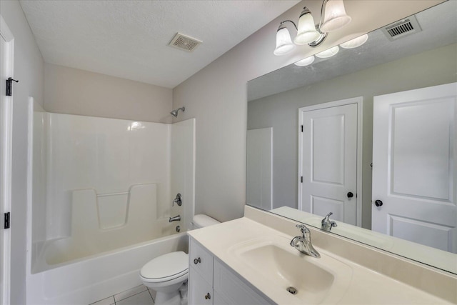 full bath featuring vanity, visible vents, a textured ceiling, and toilet