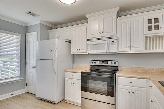2120 Whitney S Dr, Augusta, GA 30904 - kitchen featuring white appliances, white cabinetry, light wood finished floors, light countertops, and ornamental molding