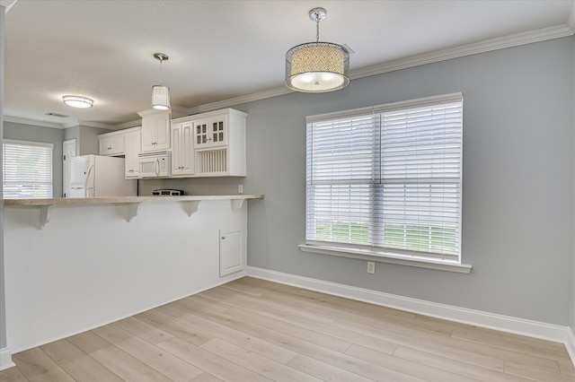 2120 Whitney S Dr, Augusta, GA 30904 - kitchen with white appliances, healthy amount of natural light, light countertops, glass insert cabinets, and ornamental molding