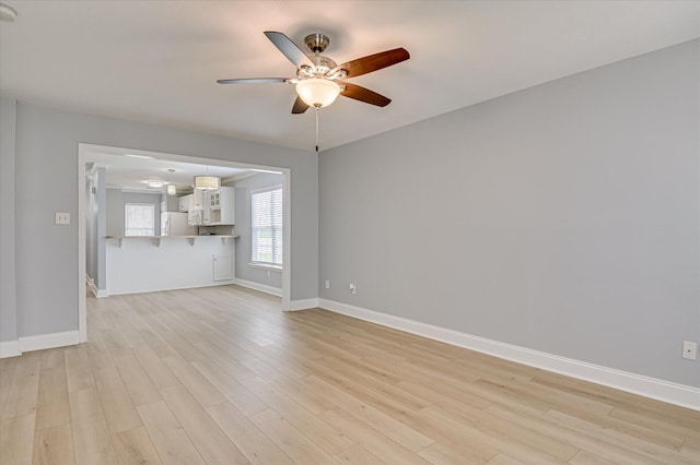 2120 Whitney S Dr, Augusta, GA 30904 - unfurnished living room featuring a ceiling fan and light wood-style flooring