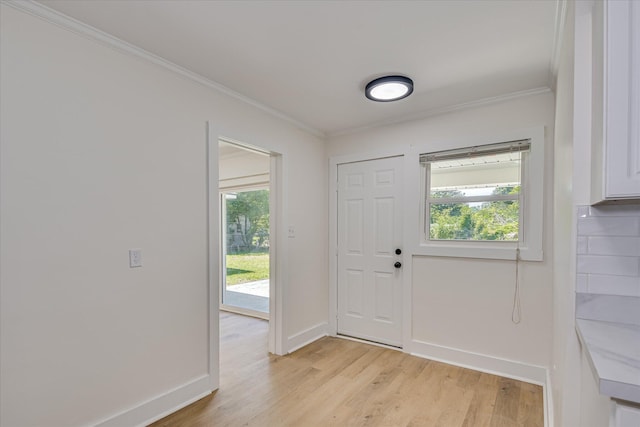 2281 Raleigh Dr, Augusta, GA 30904 - foyer with ornamental molding, light wood-style flooring, healthy amount of natural light, and baseboards