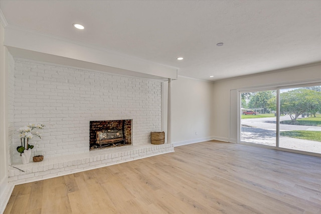 2281 Raleigh Dr, Augusta, GA 30904 - unfurnished living room with ornamental molding, wood finished floors, baseboards, a brick fireplace, and recessed lighting