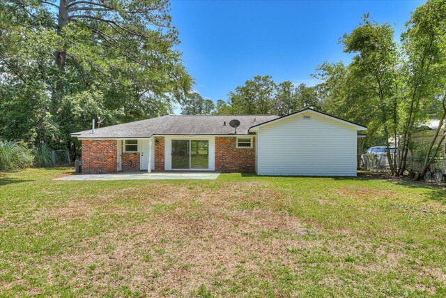 2281 Raleigh Dr, Augusta, GA 30904 - back of property with a patio area, brick siding, and a shingled roof
