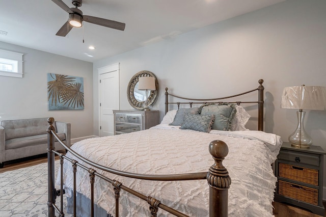 bedroom featuring wood-type flooring and ceiling fan