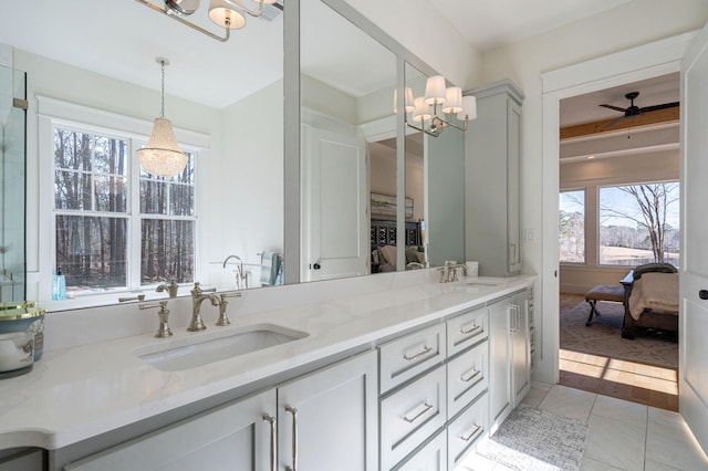 bathroom featuring ceiling fan, vanity, and tile patterned flooring