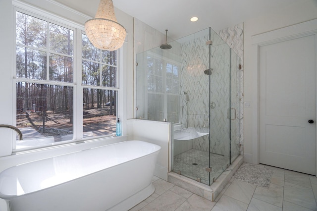 bathroom with separate shower and tub and a wealth of natural light