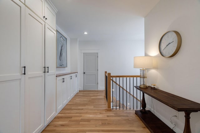 hall with light hardwood / wood-style flooring