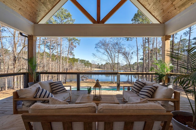 deck featuring a water view and outdoor lounge area