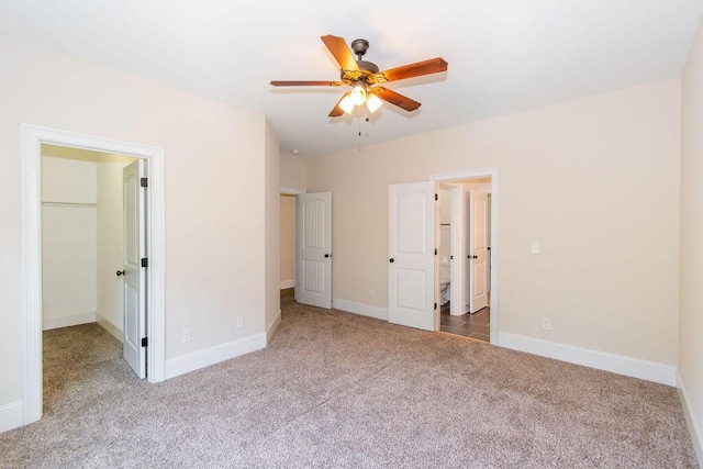 322 Pump House Rd, Evans, GA 30809 - unfurnished bedroom featuring carpet floors, a walk in closet, and ceiling fan