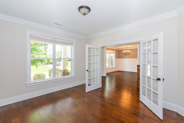 322 Pump House Rd, Evans, GA 30809 - empty room featuring french doors, a chandelier, ornamental molding, and dark wood-type flooring
