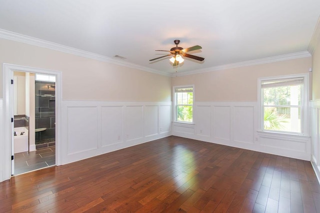 322 Pump House Rd, Evans, GA 30809 - spare room with ceiling fan, dark wood-style floors, a wainscoted wall, crown molding, and a decorative wall