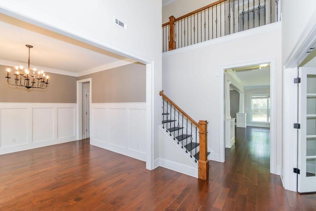 322 Pump House Rd, Evans, GA 30809 - entrance foyer featuring ornamental molding, a chandelier, wood finished floors, wainscoting, and a decorative wall