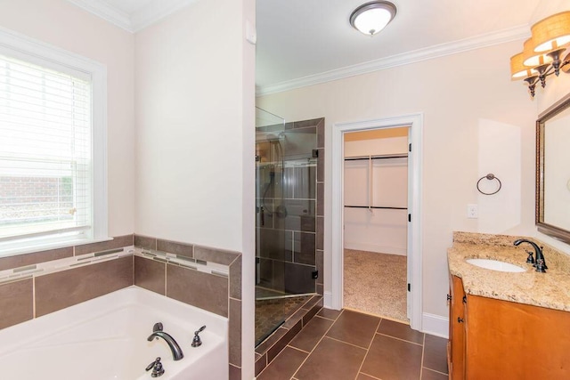 322 Pump House Rd, Evans, GA 30809 - bathroom featuring vanity, a shower stall, a garden tub, a spacious closet, and tile patterned floors