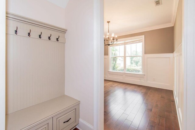 322 Pump House Rd, Evans, GA 30809 - mudroom with a chandelier, dark wood finished floors, crown molding, and a wainscoted wall