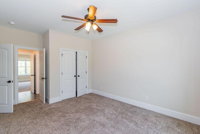 322 Pump House Rd, Evans, GA 30809 - unfurnished bedroom with carpet flooring, a closet, and a ceiling fan