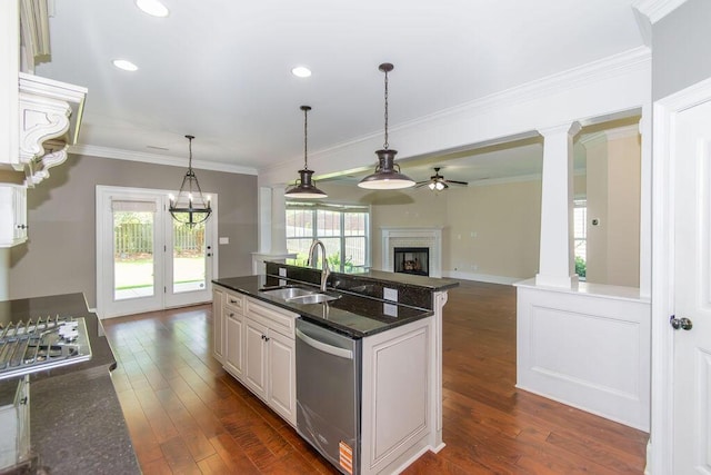 322 Pump House Rd, Evans, GA 30809 - kitchen featuring a ceiling fan, a fireplace, stainless steel appliances, decorative columns, and crown molding