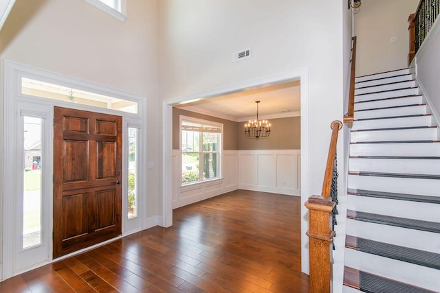 322 Pump House Rd, Evans, GA 30809 - foyer with a chandelier, stairway, dark wood finished floors, ornamental molding, and a high ceiling