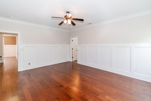 322 Pump House Rd, Evans, GA 30809 - empty room with a decorative wall, ceiling fan, ornamental molding, dark wood-style floors, and a wainscoted wall