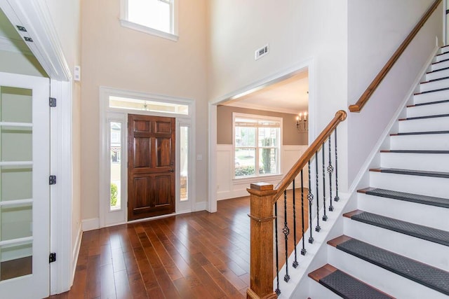 322 Pump House Rd, Evans, GA 30809 - foyer entrance featuring dark wood-style floors, a chandelier, a high ceiling, and stairs
