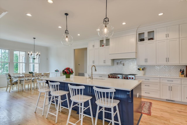 605 Whimbrel Ct, Evans, GA 30809 - kitchen featuring a sink, light countertops, backsplash, white cabinetry, and recessed lighting