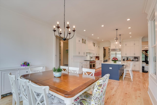 605 Whimbrel Ct, Evans, GA 30809 - dining room featuring ornamental molding, recessed lighting, a chandelier, and light wood finished floors