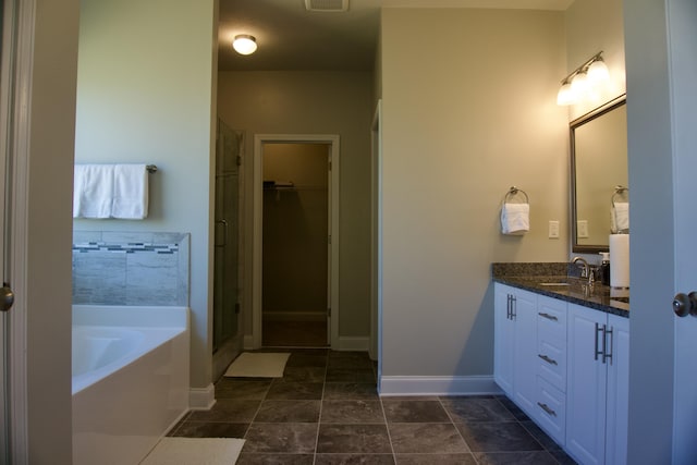4042 Cottingham Way, Augusta, GA 30909 - full bathroom featuring vanity, a garden tub, a shower stall, baseboards, and tile patterned floors