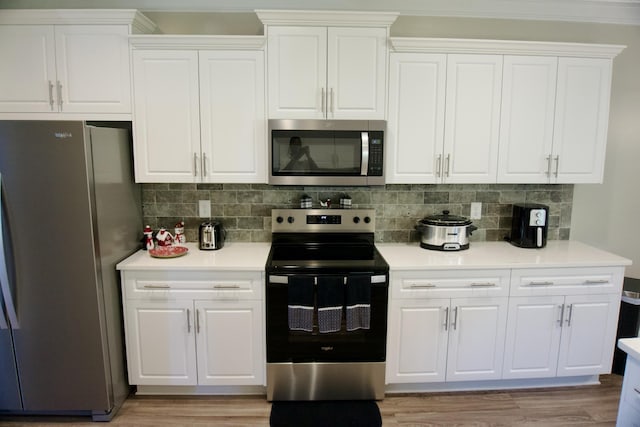 4042 Cottingham Way, Augusta, GA 30909 - kitchen with appliances with stainless steel finishes, white cabinetry, and light countertops
