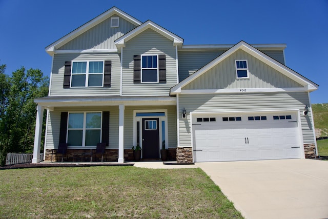 4042 Cottingham Way, Augusta, GA 30909 - craftsman inspired home with board and batten siding, stone siding, a porch, a front lawn, and driveway