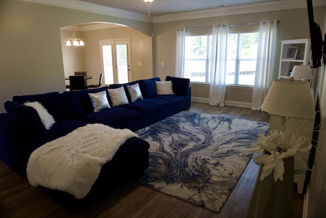 4042 Cottingham Way, Augusta, GA 30909 - living area featuring arched walkways, ornamental molding, baseboards, wood finished floors, and a chandelier