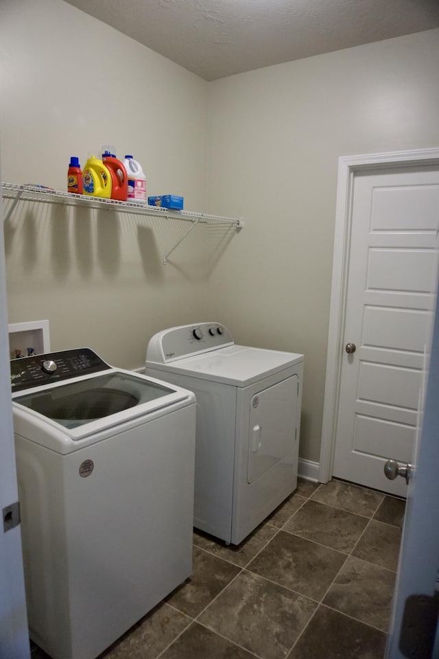 4042 Cottingham Way, Augusta, GA 30909 - laundry area featuring washing machine and dryer and dark tile patterned floors