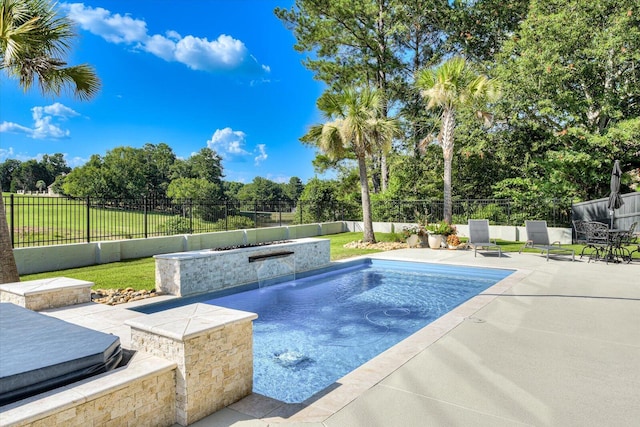 view of pool with a fenced backyard and a patio