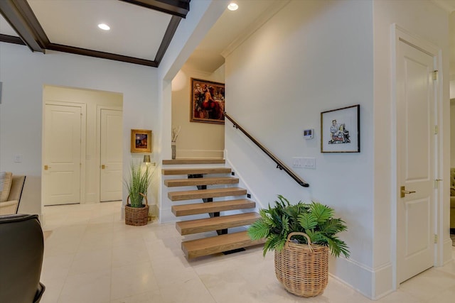 stairs featuring baseboards, ornamental molding, and recessed lighting