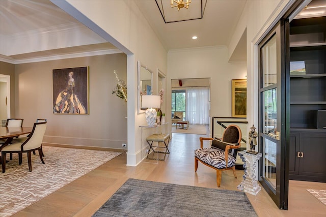 entryway with ornamental molding, recessed lighting, light wood-style floors, and baseboards