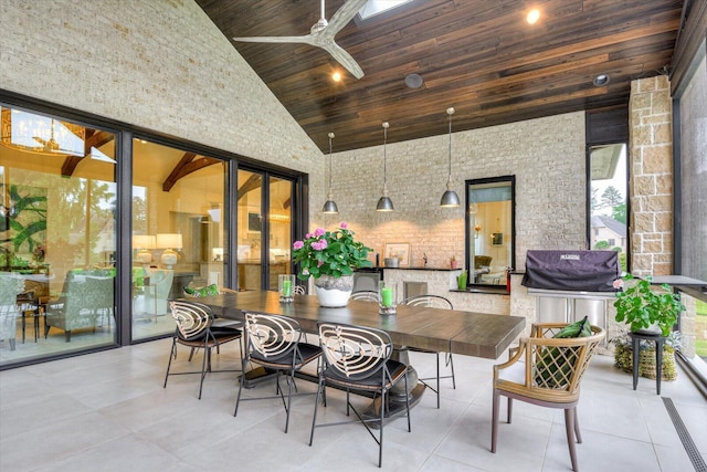 view of patio / terrace with a ceiling fan, outdoor dining space, and area for grilling