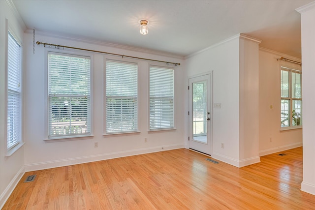 920 Napiers Post Dr, Evans, GA 30809 - spare room featuring light wood-type flooring, healthy amount of natural light, and crown molding