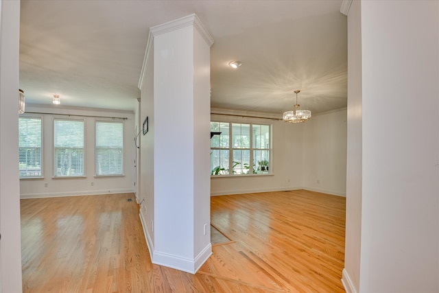 920 Napiers Post Dr, Evans, GA 30809 - unfurnished room with light wood finished floors, a chandelier, and crown molding
