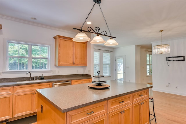 920 Napiers Post Dr, Evans, GA 30809 - kitchen featuring ornamental molding, a kitchen island, healthy amount of natural light, dishwasher, and light wood-type flooring