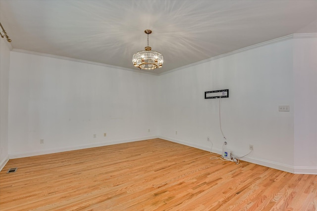 920 Napiers Post Dr, Evans, GA 30809 - unfurnished room with crown molding, a chandelier, and light wood finished floors