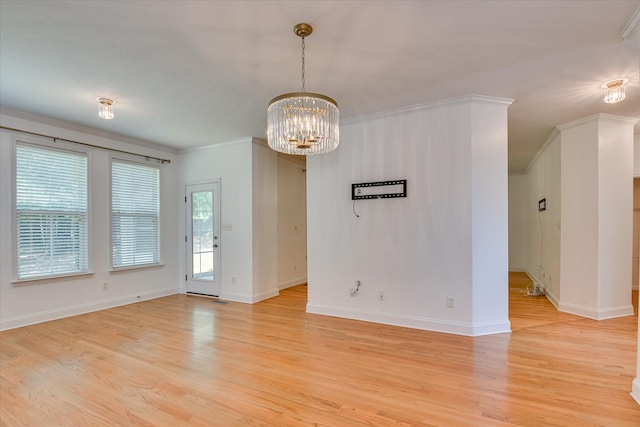 920 Napiers Post Dr, Evans, GA 30809 - unfurnished room with crown molding, light wood finished floors, and a chandelier