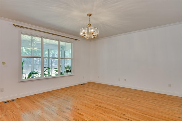 920 Napiers Post Dr, Evans, GA 30809 - spare room with ornamental molding, light wood-type flooring, and a chandelier