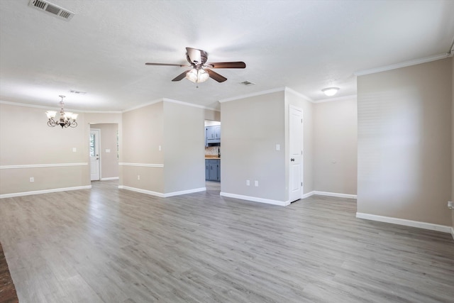 305 Manchester Ct, Grovetown, GA 30813 - unfurnished living room featuring a ceiling fan, a chandelier, ornamental molding, light wood-style flooring, and baseboards
