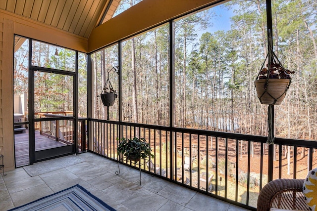 unfurnished sunroom with vaulted ceiling