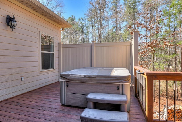 deck featuring a hot tub