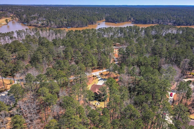 bird's eye view with a forest view and a water view