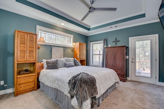 bedroom featuring access to outside, visible vents, a tray ceiling, and carpet floors