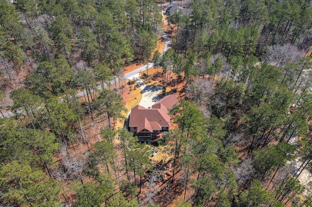 drone / aerial view with a view of trees