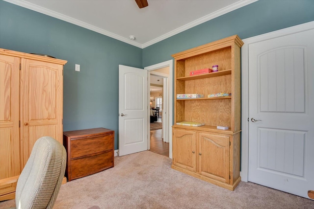 office with light carpet, a ceiling fan, and ornamental molding