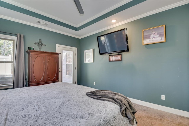 bedroom featuring a ceiling fan, visible vents, baseboards, carpet floors, and ornamental molding