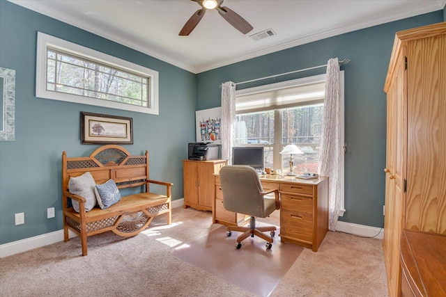 office space with crown molding, a healthy amount of sunlight, visible vents, and ceiling fan